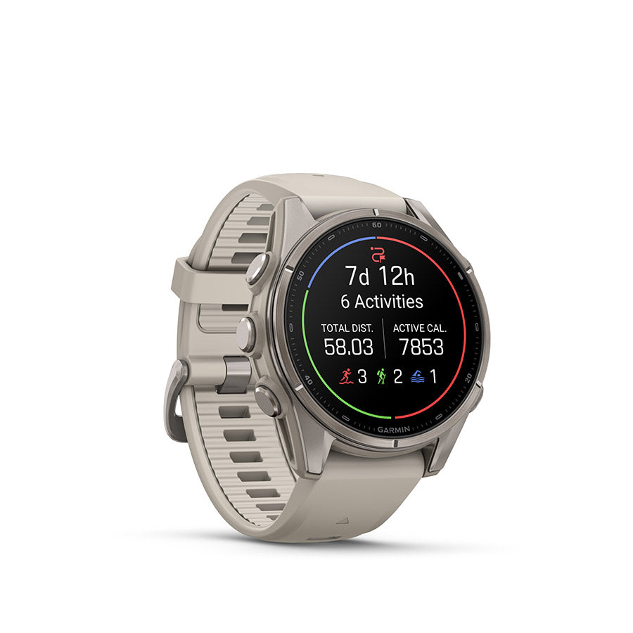 Garmin Fenix 9 43mm cycling computer display showing GPS, metrics, and navigation features on a black watch face.