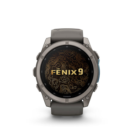 Garmin Fenix 9 51mm cycling computer with GPS and fitness tracking display, showing a colorful interface on a watch face.