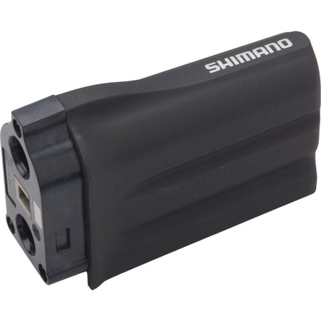 Shimano Di2 battery for electronic shifters, compact and rechargeable, shown in a close-up image.