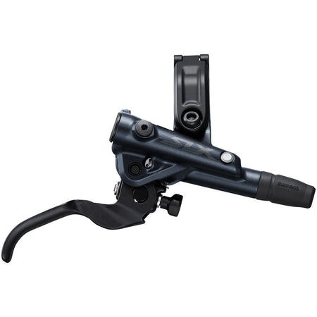 Shimano SLX M7100 disc brake with black caliper and rotor mounted on mountain bike wheel for reliable stopping power.