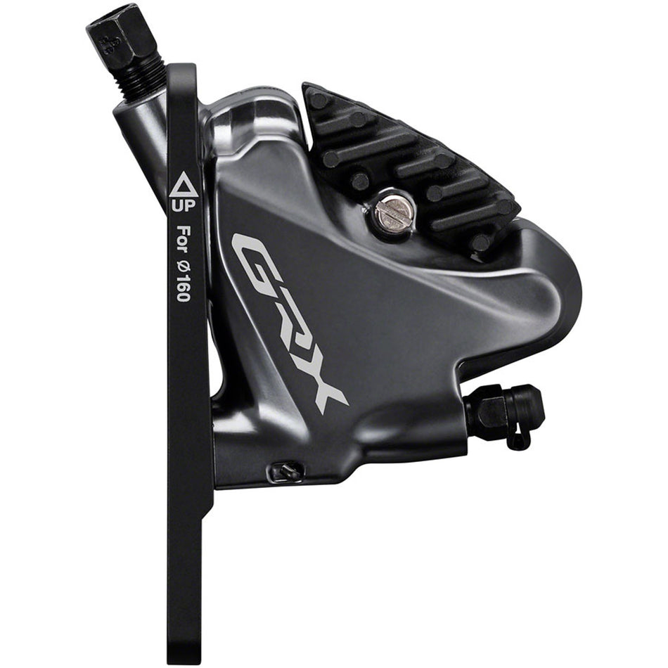 Shimano GRX RX810 disc brake with caliper and rotor for gravel and road bikes, showing sleek black design and mounting details.