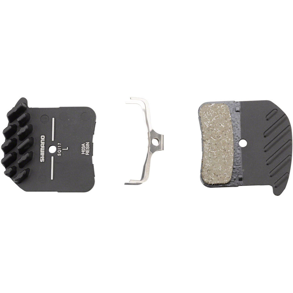 Shimano H03A disc brake pads for bike braking system, shown in this image with detailed view of the brake pad surface.