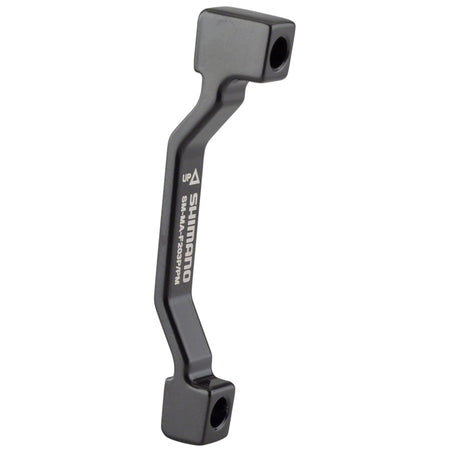 Shimano disc brake adapter for bike brake system, used as a brake part and accessory for mounting and compatibility.