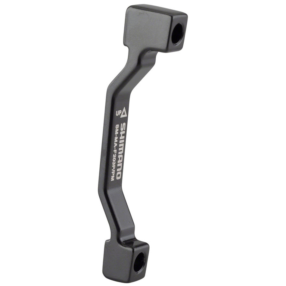 Shimano disc brake adapter for bike brake system, used as a brake part and accessory for mounting and compatibility.
