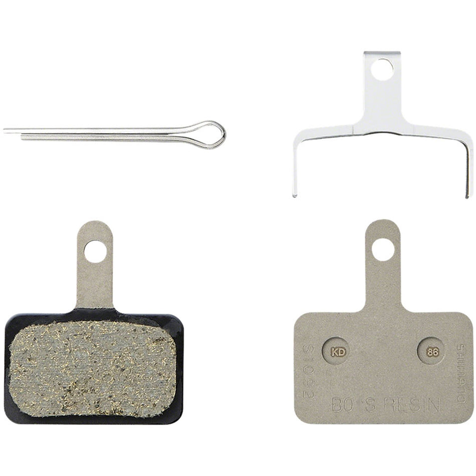 Shimano B05S disc brake pads showing black friction material and metal backing plate for bicycle braking systems.