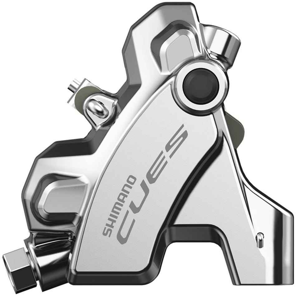 Shimano CUES BR-U6030 disc brake caliper mounted on bicycle frame, showing detailed brake caliper design and mounting hardware.