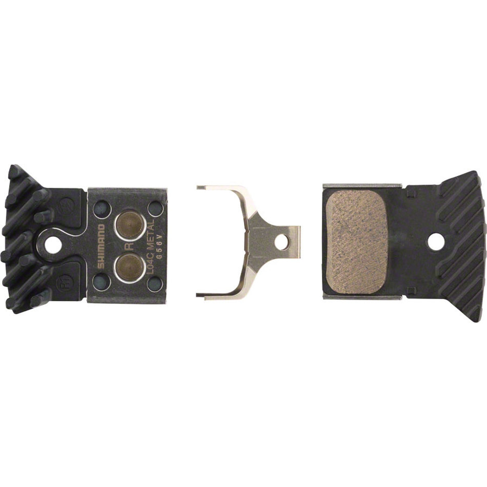 Shimano L04C disc brake pads showing metal backing plates and friction material for bicycle brake system.