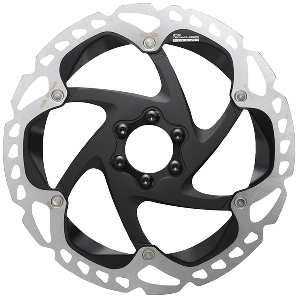 Shimano RT-MT905 disc brake rotor showing detailed metal rotor with ventilation holes and mounting edges for mountain bike braking.