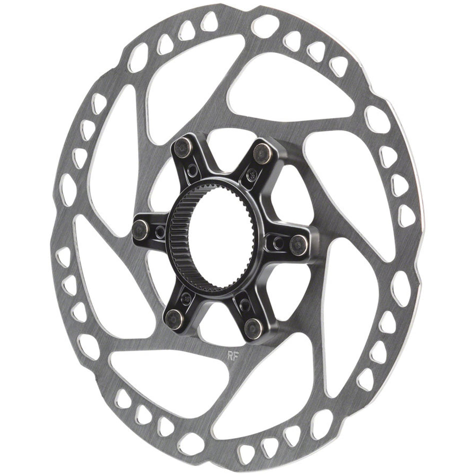 Shimano SM-RT64 disc brake rotor showing vented steel surface and mounting holes for mountain bike braking system.