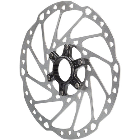 Shimano SM-RT64 disc brake rotor showing vented metal surface and mounting holes used for bicycle braking systems.