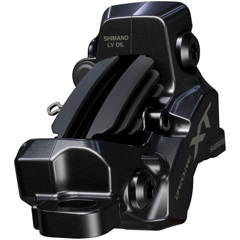 Shimano Deore XT BR-M8220 Enduro disc brake caliper mounted on bike frame, showcasing hydraulic brake components and branding