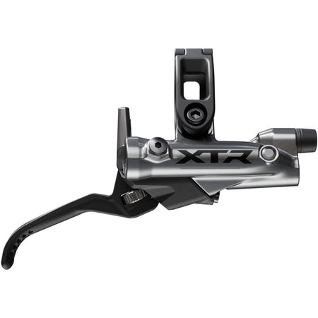 Shimano XTR M9200 disc brake and M9220 brake lever mounted on a bike, showcasing high-performance mountain biking components.