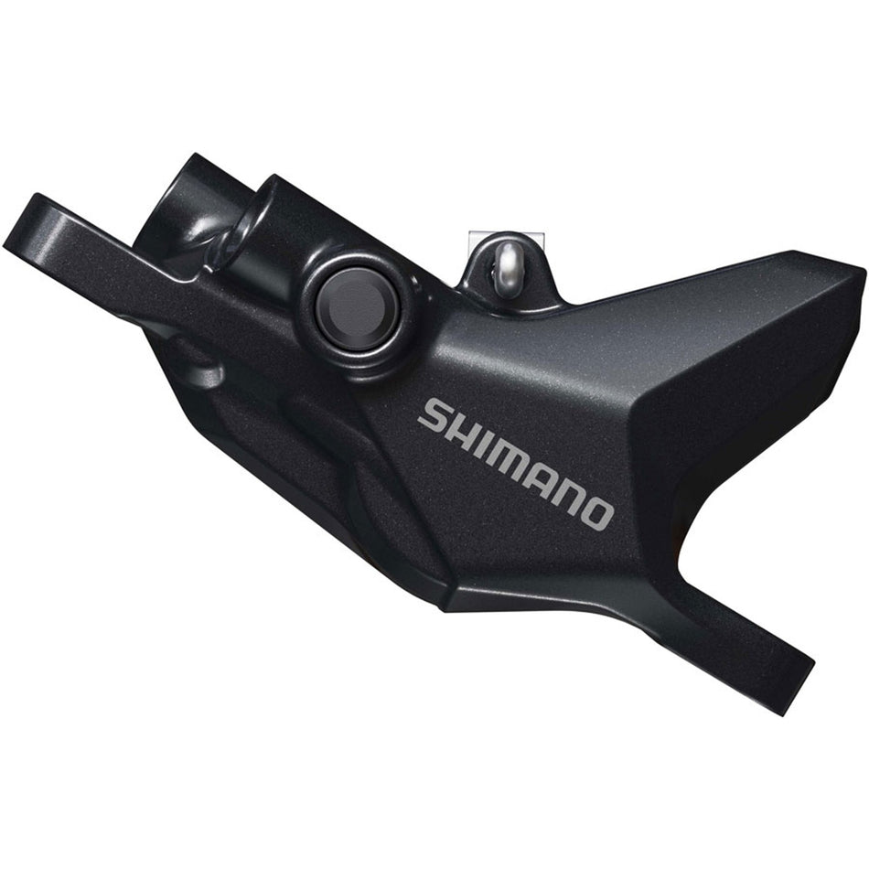 Shimano Deore BR-MT600 disc brake caliper mounted on a bicycle, showcasing the Shimano brake calipers for mountain biking.