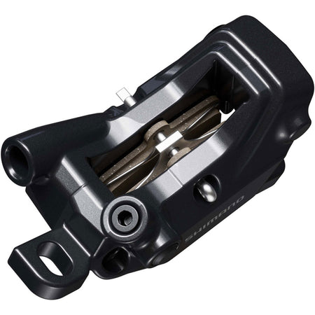 Shimano Deore BR-MT620 disc brake caliper with black body and mounting hardware, designed for mountain bike braking systems.