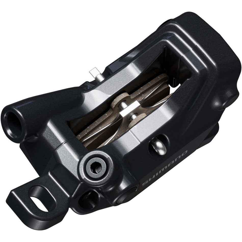 Shimano Deore BR-MT620 disc brake caliper with black body and mounting hardware, designed for mountain bike braking systems.