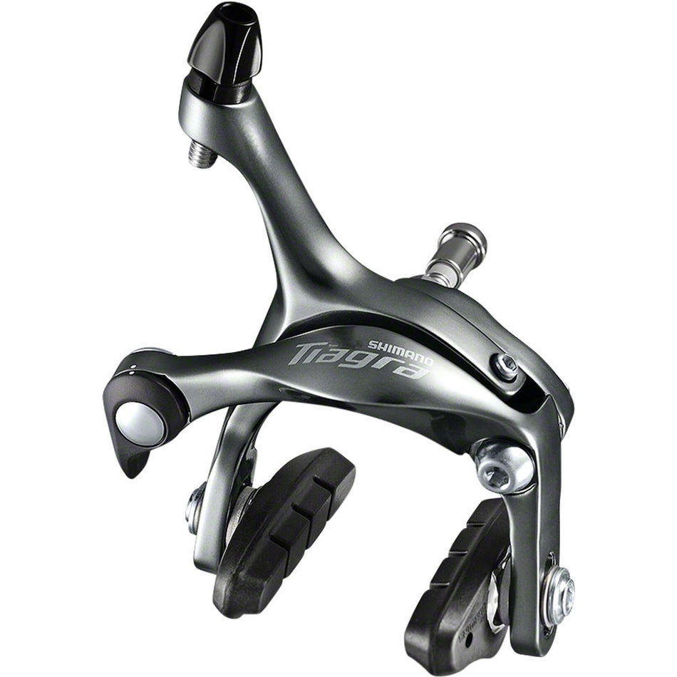 Shimano Tiagra BR-4700 road rim brake calipers mounted on a bicycle, showcasing sleek design and braking components.
