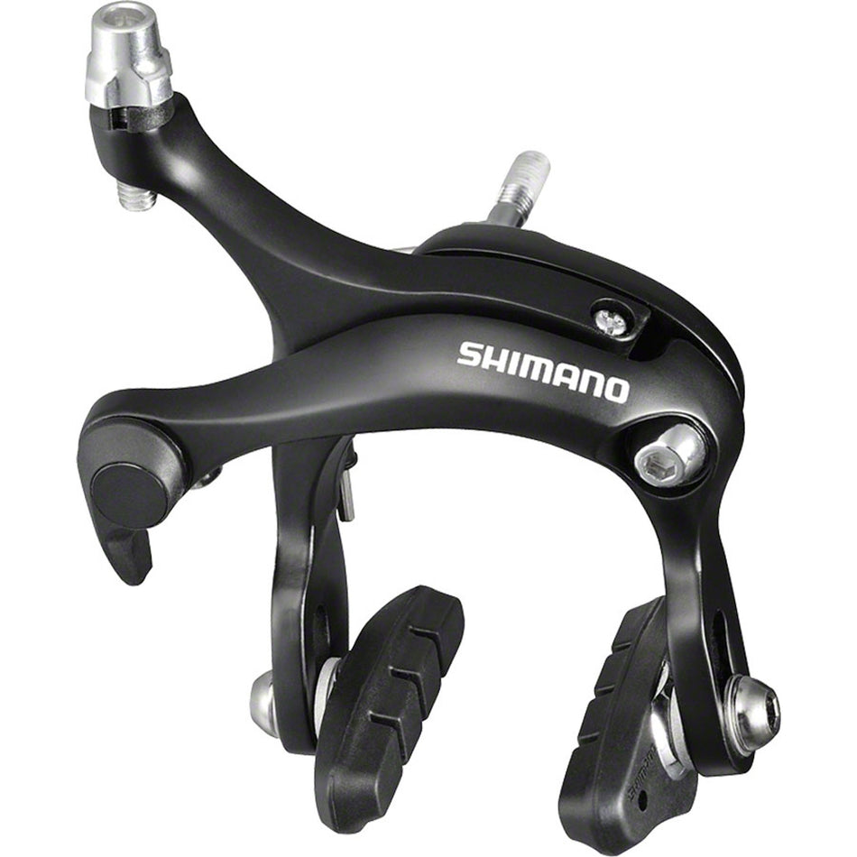 Shimano BR-R451 road brake calipers mounted on bicycle wheel, showcasing lightweight brake calipers for road cycling.