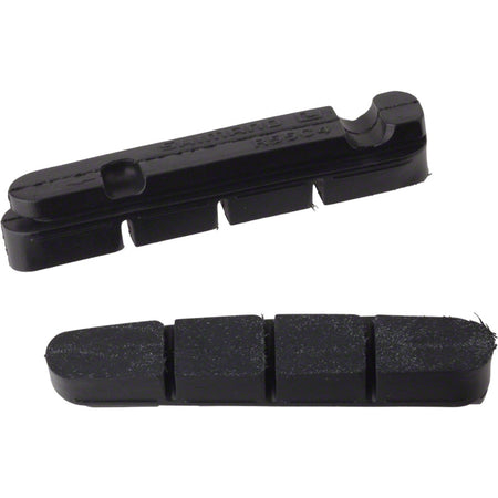 Shimano replacement brake pads for road bike brake shoes, shown in a close-up image with detailed pad surfaces.