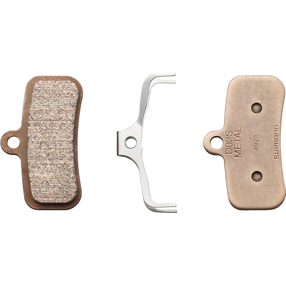 Shimano D02S metal disc brake pads for Shimano 4-piston calipers, showing the brake pad design and metal contact surface.