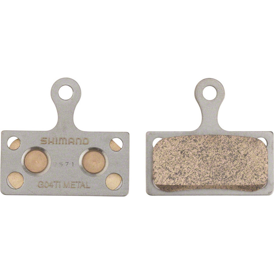 Shimano G04Ti metal disc brake pads with titanium back plate for Shimano 2-piston calipers, shown in the image.