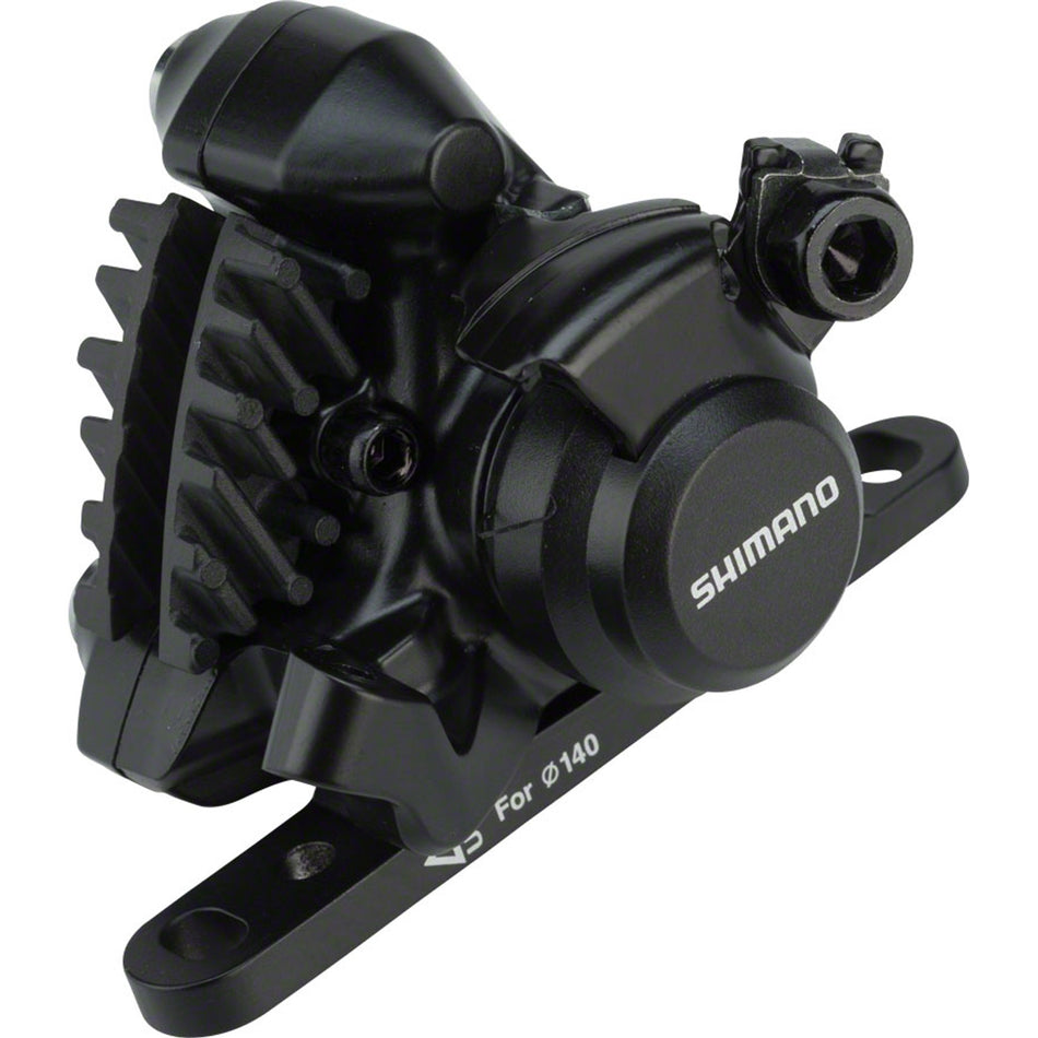 Shimano BR-RS305 disc brake caliper mounted on a bicycle wheel, showcasing its design and mounting hardware for mountain or road bikes.