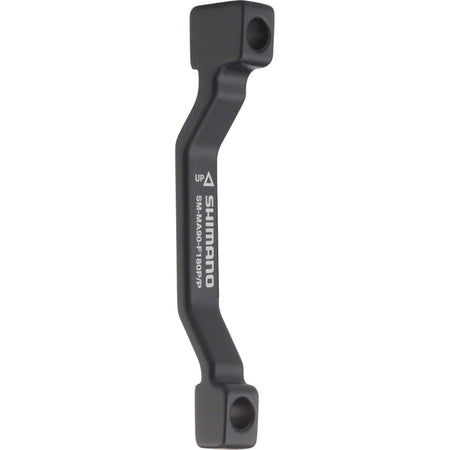 Shimano disc brake adapter for bike brake system, mounted on the brake caliper, showcasing compatibility with Shimano brake parts.
