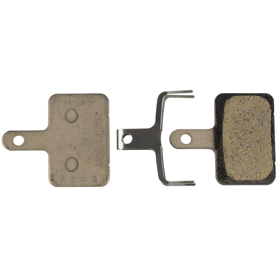Shimano M05 disc brake pads for Shimano 2-piston calipers, showing the brake pad set with metal backing and friction material.