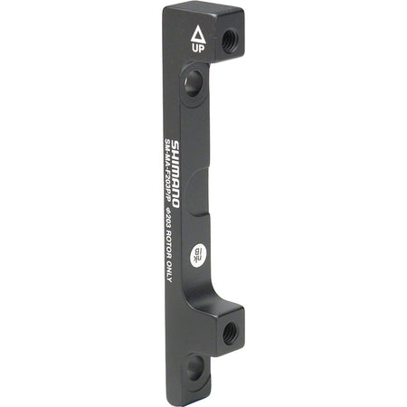 Shimano disc brake adapter for bicycle brake system, mounting component for brake calipers and rotors.