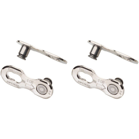 Shimano chain links and pins for bicycle chains, showing metal links and pins on a clean background.