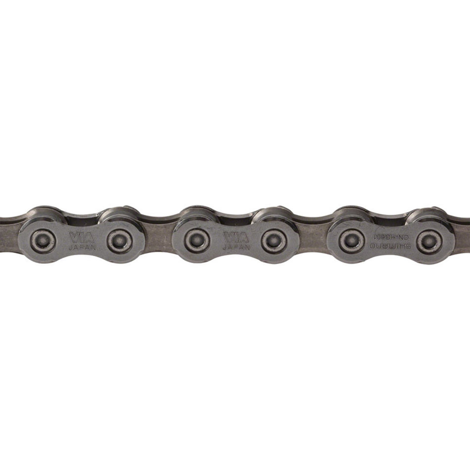 Shimano CN-HG601 chain for bicycles, close-up view showing metal links and construction, suitable for mountain and road bikes.