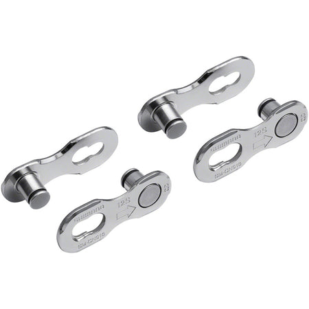 Shimano chain links and pins for bicycle chains, close-up of metal components with detailed links and pins.