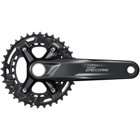 Shimano Deore M4100 crankset with black crank arms and chainring, mounted on a bike, showcasing durable mountain biking components.