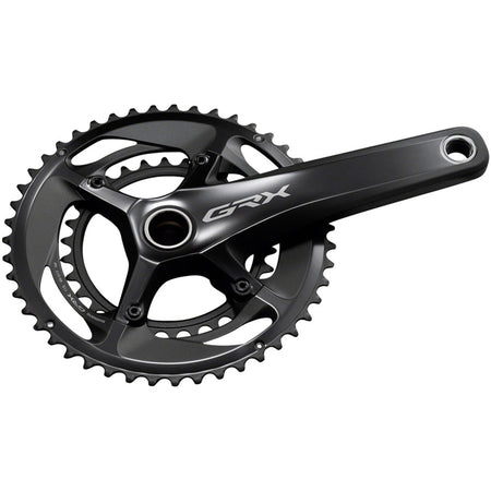 Shimano GRX FC-RX810 crankset with double chainring for gravel bikes, featuring lightweight aluminum arms and integrated chain guard.