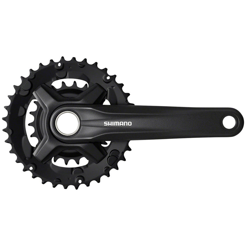 Shimano FC-MT210 crankset with black arms and chainring, designed for mountain bikes, showing the crankset components and branding.