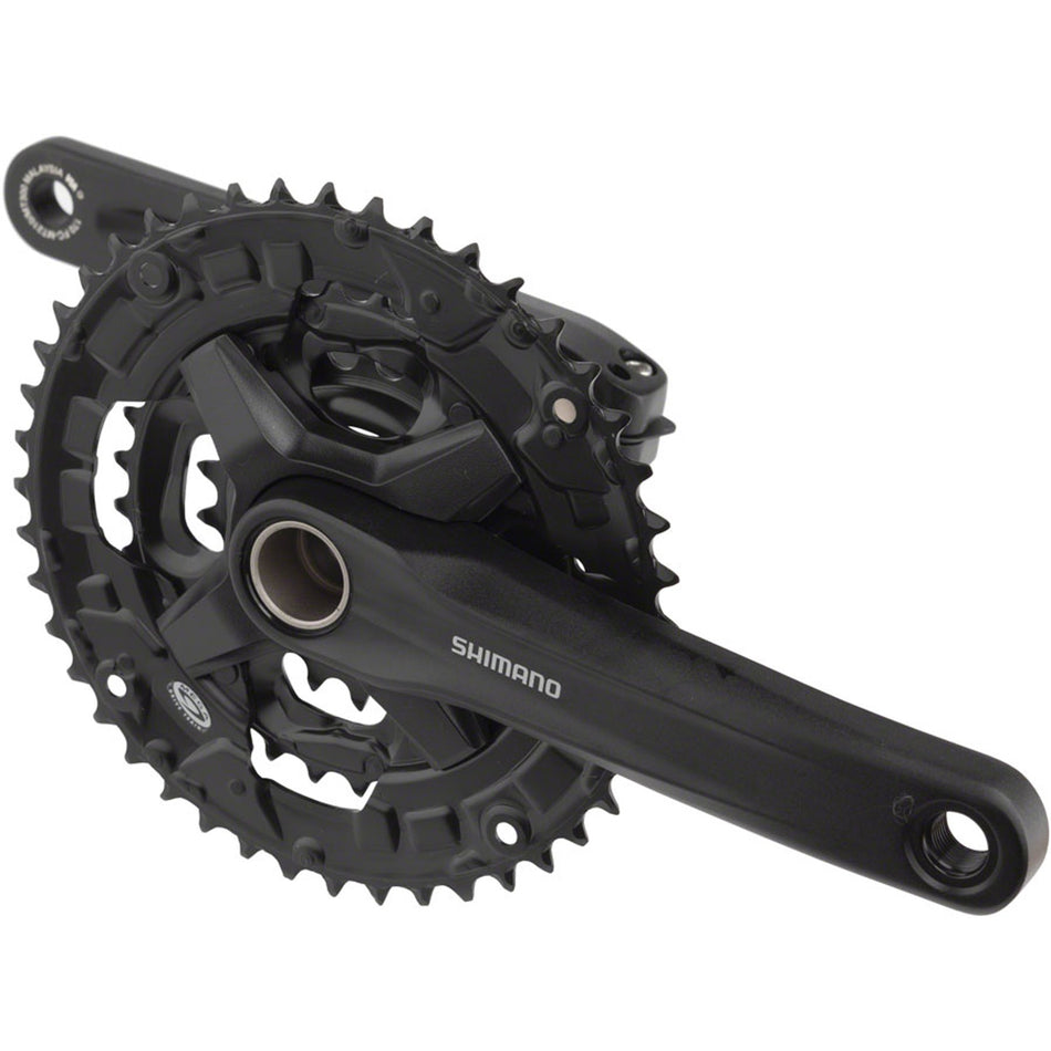 Shimano FC-MT210-3 crankset with three chainrings, black finish, lightweight design, and sturdy construction for mountain biking.