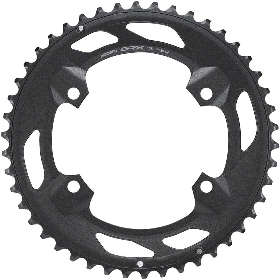 Shimano GRX FC-RX600 chainring for bike drivetrain, close-up of black chainring with teeth and mounting holes.