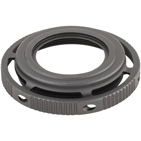 Shimano XTR FCM9100 crankset adjust nut, close-up view showing metal component used for bike crankset assembly.