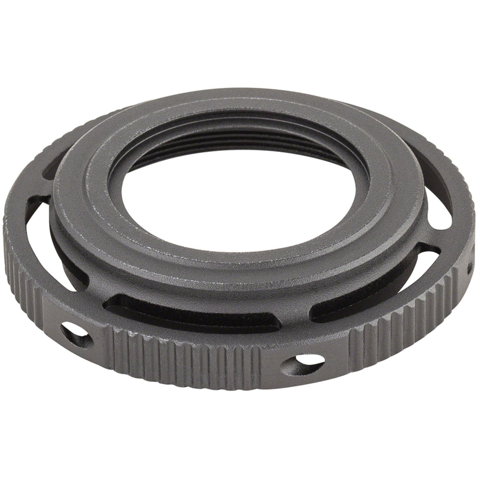Shimano XTR FCM9100 crankset adjust nut, close-up view showing metal component used for bike crankset assembly.