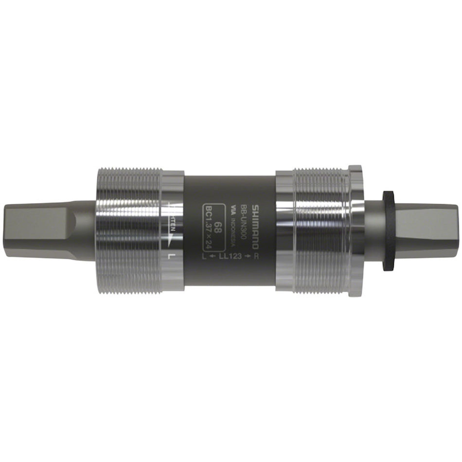Shimano BB-UN300 square spindle bottom bracket installed on a bicycle crankset, close-up view of the component and threading.