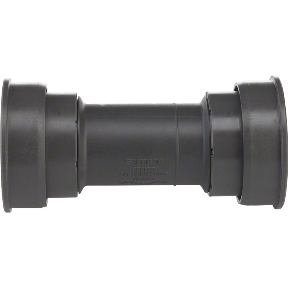 Shimano Ultegra BB72 BBR60 Hollowtech II bottom bracket with black exterior and metal bearing cups for road bike compatibility.