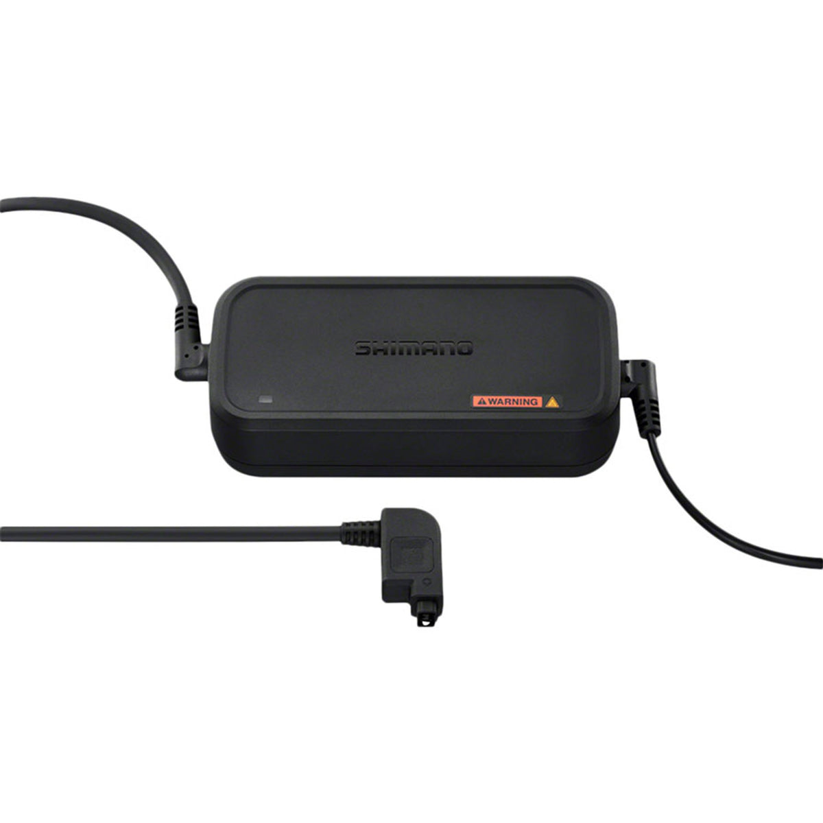 Shimano Steps eBike battery charger connected to a charging port, showing a compact black charger for e-bike batteries.