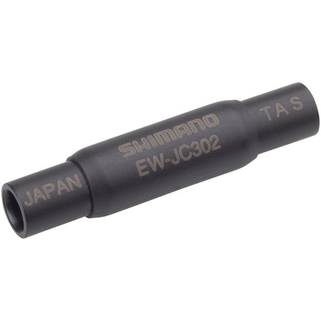 Shimano Di2 Frame Junction Box for electronic shifters, mounted on bike frame with cables connected, used in electronic shifting systems.