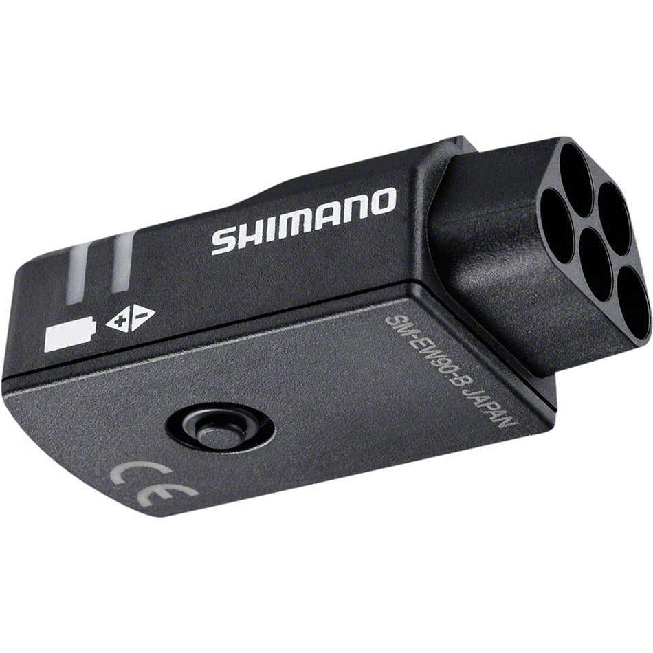 Shimano Di2 Junction Box for electronic shifters, compact device with wiring ports for e-bike gear system connection.