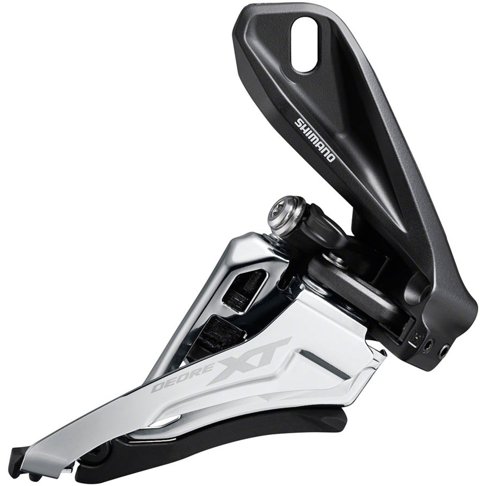 Shimano Deore XT FD-M8100 front derailleur mounted on bicycle frame, showing the mechanical components and mounting hardware.