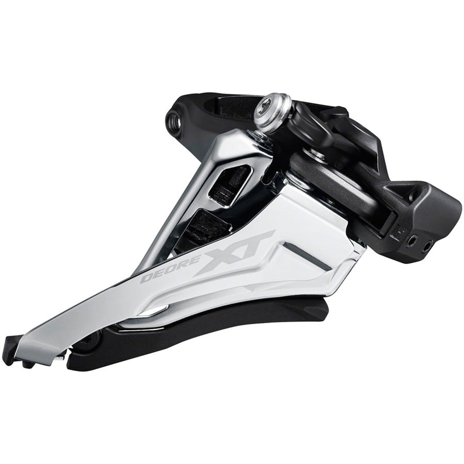 Shimano Deore XT FD-M8100 front derailleur mounted on bicycle frame, showing its sleek design and mounting hardware.