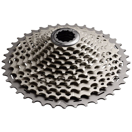 Shimano XT CS-M8000 11-speed cassette with silver cogs for mountain bike gearing, mounted on a bike wheel.
