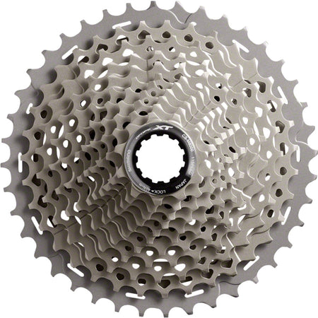 Shimano XT CS-M8000 11-speed cassette with black sprockets and silver lockring, designed for mountain bike gearing.