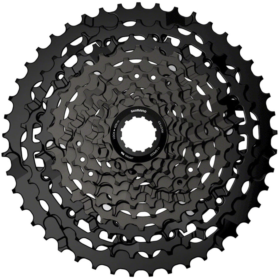 Shimano CUES CS-LG700 Linkglide cassette with multiple gears for versatile bike shifting, shown in close-up image.