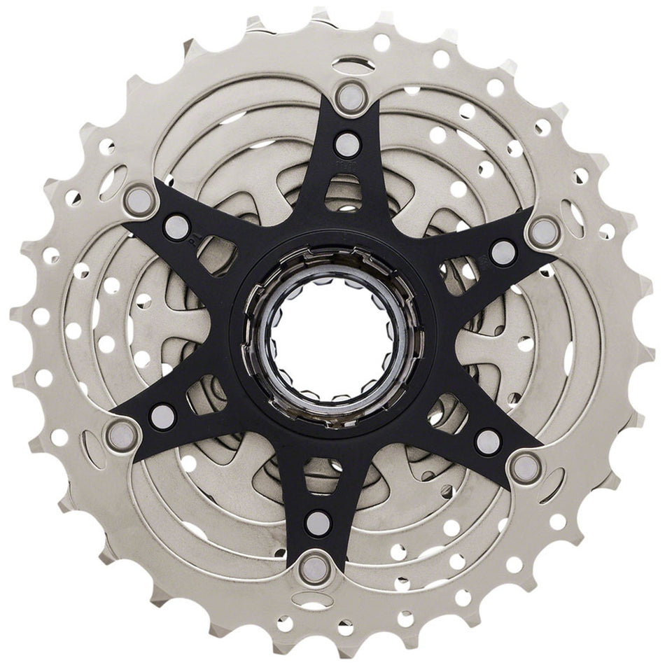 Shimano 105 CS-HG700-11 cassette with removable spacer for MTB hub compatibility, showing silver cogs and gear teeth.