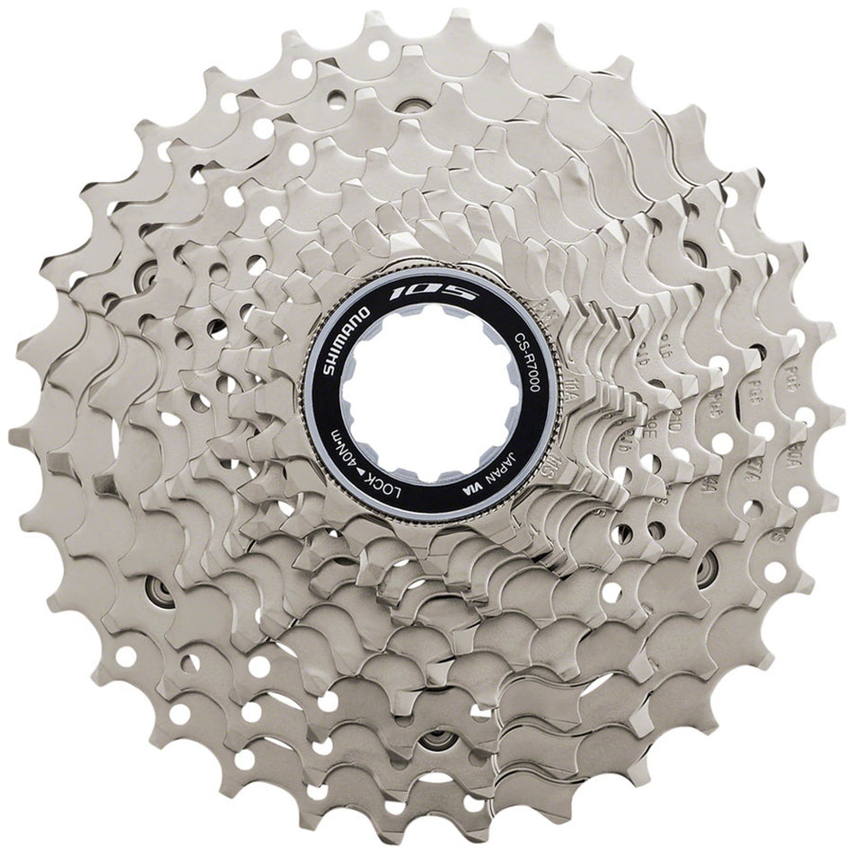 Shimano 105 CS-HG700-11 cassette with removable spacer for MTB hub compatibility, featuring multiple gears and silver finish.